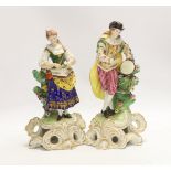 A pair of Continental porcelain figures of musicians, pseudo Derby marks, 27cm