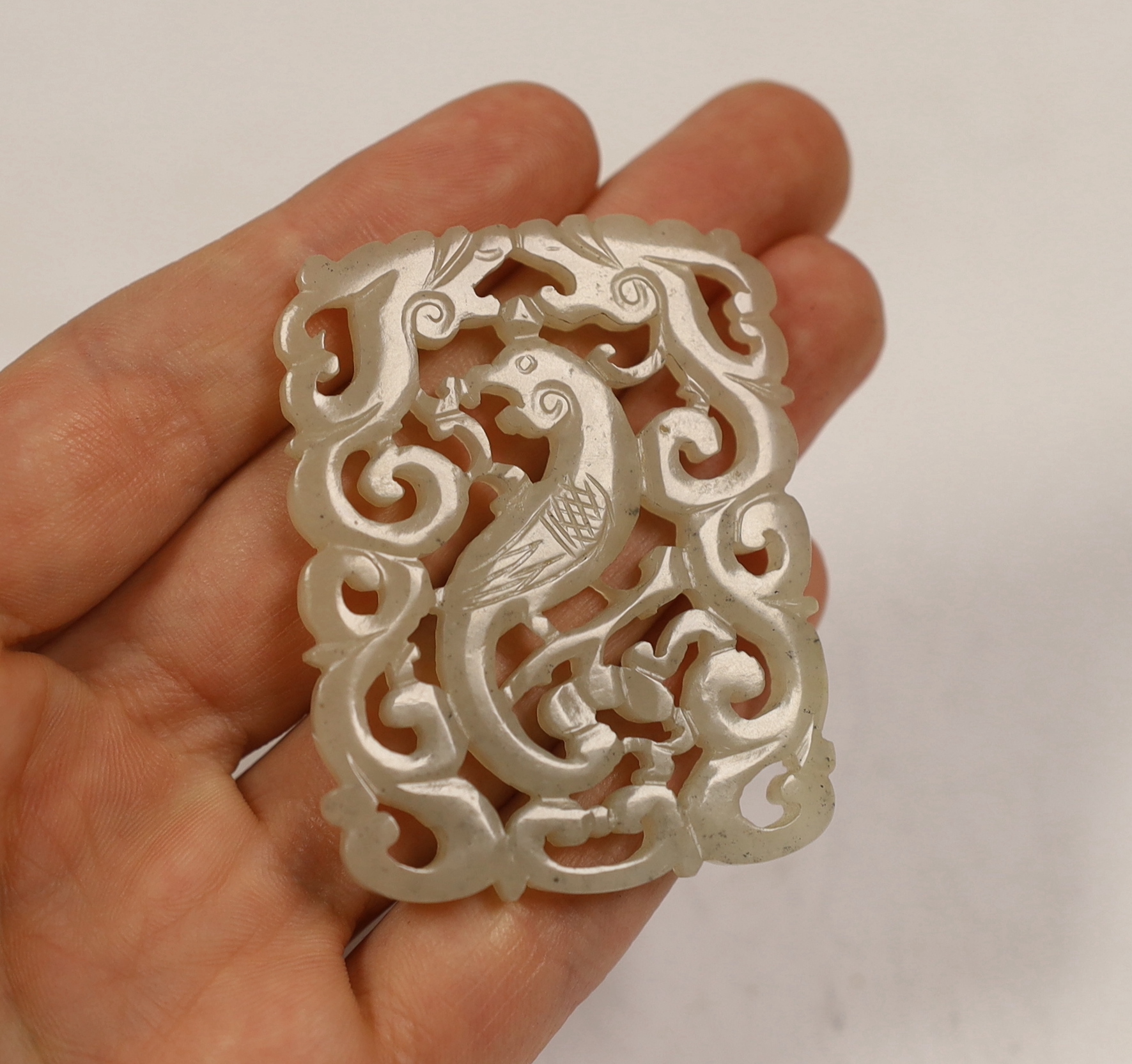 A Chinese jade ‘phoenix’ plaque, late 19th/early 20th century, 5.5 x 4.4cm on hardwood stand, - Image 2 of 3