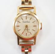 A lady's 18ct gold manual wind Cristal Watch, on a 1960's 9ct gold bracelet, overall length 16cm,