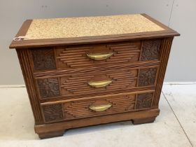 A French Art Deco carved oak three drawer chest with simulated marble top, width 105cm, depth