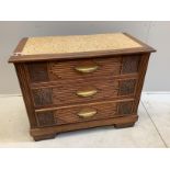 A French Art Deco carved oak three drawer chest with simulated marble top, width 105cm, depth