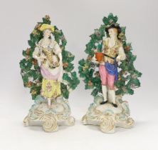 A pair of Continental porcelain figures of gardeners, pseudo Chelsea marks, 28cm high