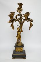 A 19th century ormolu and slate cherubic candelabrum, 58cm