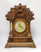A carved wood clock with barometer, thermometer and compass, 52cm high