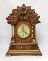 A carved wood clock with barometer, thermometer and compass, 52cm high