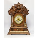 A carved wood clock with barometer, thermometer and compass, 52cm high