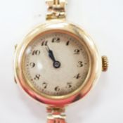 A lady's early to mid 20th century 9ct gold manual wind wrist watch(a.f.), on a yellow metal