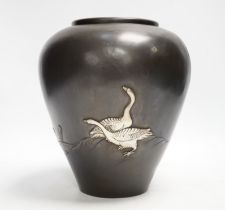 A Japanese white metal overlaid bronze vase, Meiji period, 21cm
