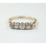 An 18ct and graduated five stone diamond set half hoop ring, size N, gross weight 2.5 grams.