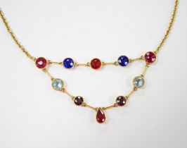 An early 20th century 15ct and ten stone multi coloured doublet set necklace, 49cm, gross weight