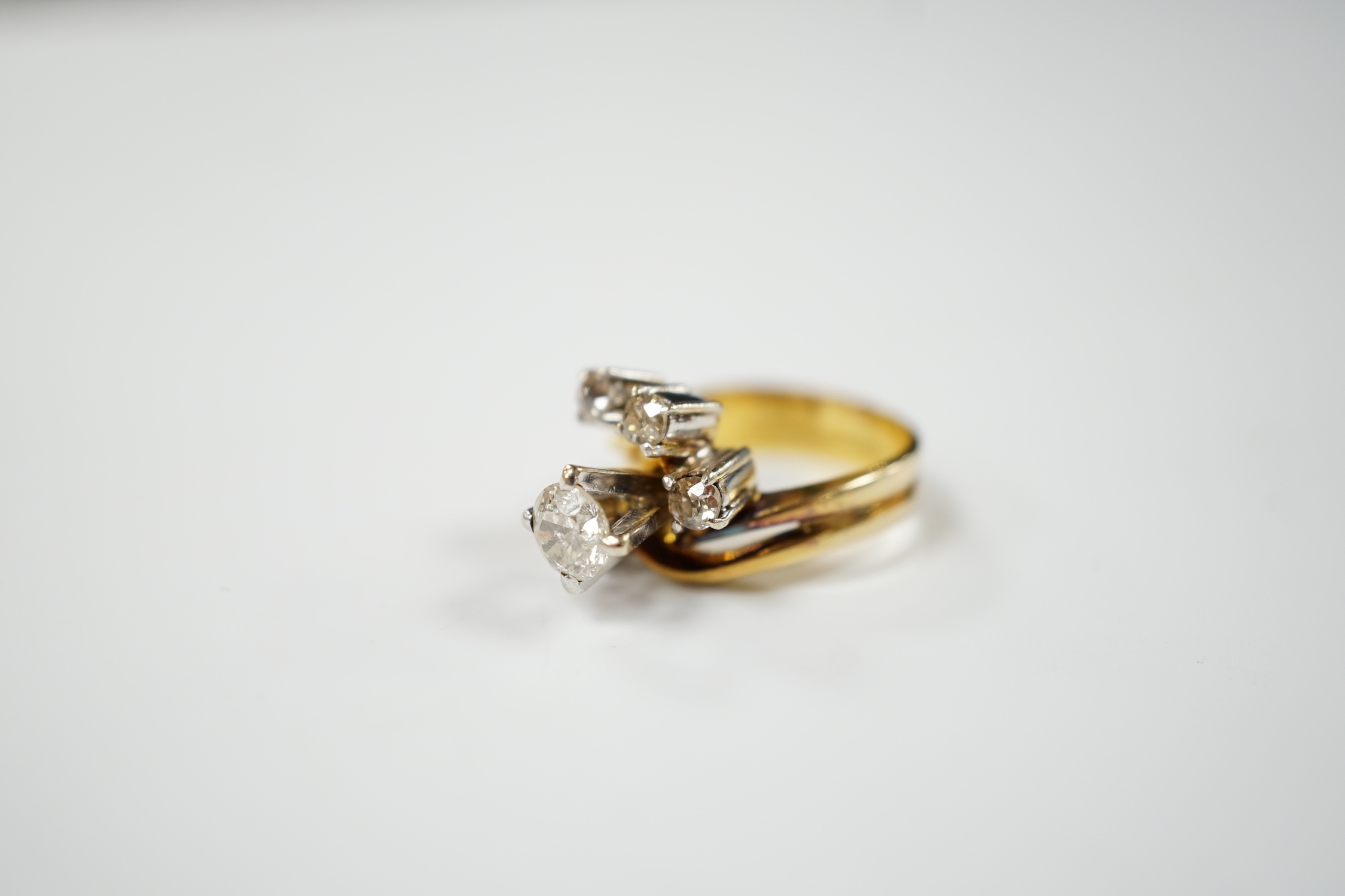 A yellow metal and graduated five stone diamond cluster set dress ring, in a raised setting, size - Image 2 of 4