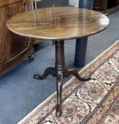 A George III circular mahogany birdcage action tilt top tea table, diameter 70cm, height 70cm