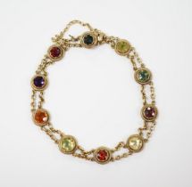 An early 20th century yellow metal (stamped 15) and ten stone multi gem set chain link bracelet,