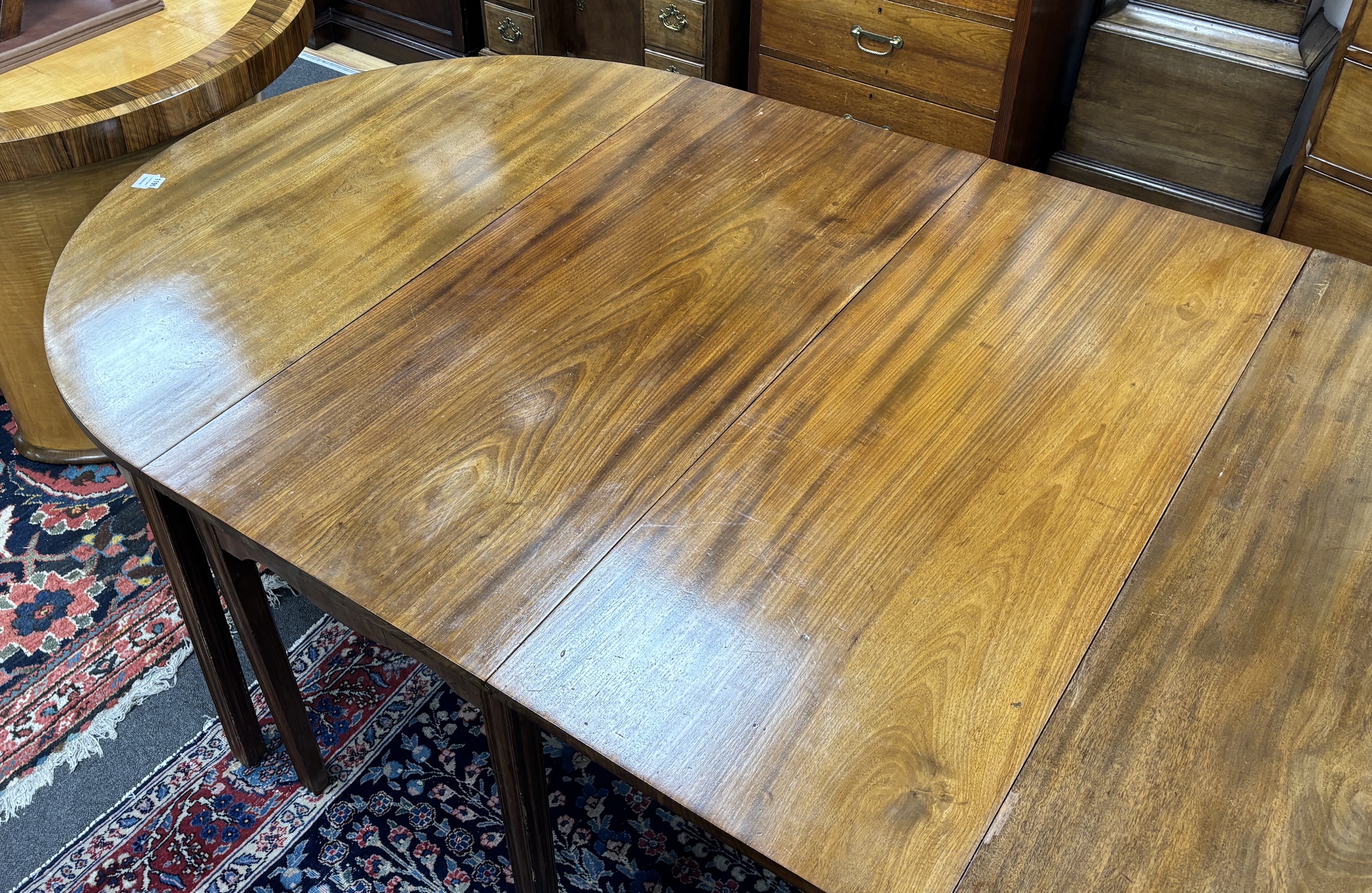 A George III mahogany D end extending dining table, 264cm extended, three spare leaves, width 121cm, - Image 3 of 4