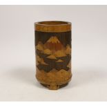 A Japanese bamboo brushpot carved with mountains and pagodas, 13cm high