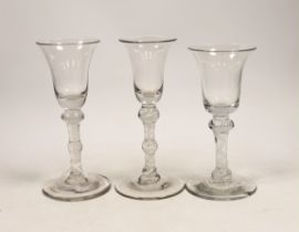 Three George III DSOT stem wine glasses, c.1760, largest 17cm high