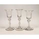 Three George III DSOT stem wine glasses, c.1760, largest 17cm high