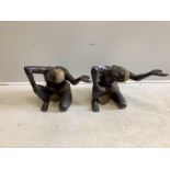 A pair of bronze Blackamoor table stands, width 57cm, height 43cm