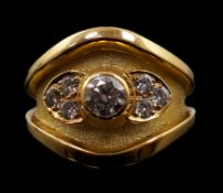 A 1990's part textured 18ct gold and collet set single stone diamond ring by Leo De Vroomen, with