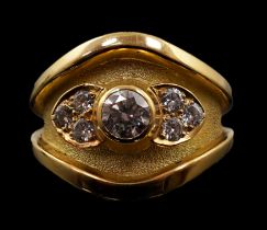 A 1990's part textured 18ct gold and collet set single stone diamond ring by Leo De Vroomen, with