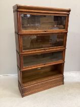 A Globe Wernicke oak four section bookcase, width 86cm, depth 27cm, height 140cm (one door