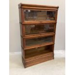 A Globe Wernicke oak four section bookcase, width 86cm, depth 27cm, height 140cm (one door