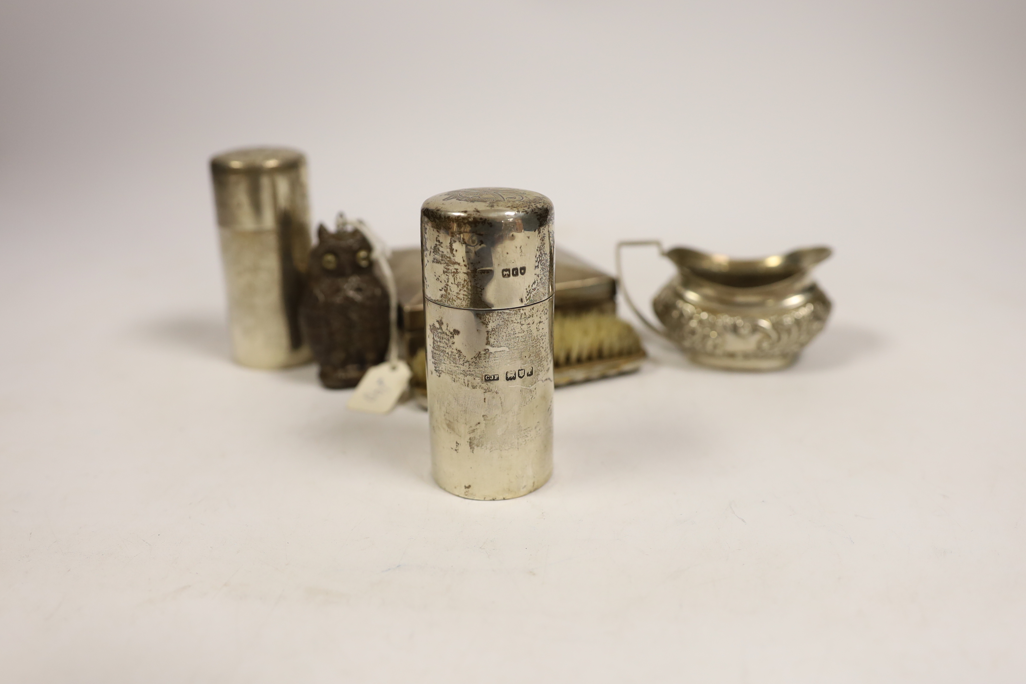 A late Victorian embossed silver cream jug, a pair of silver toilet bottles, a silver backed - Bild 4 aus 4