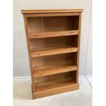 An early 20th century pitch pine open bookcase, width 75cm, depth 25cm, height 122cm