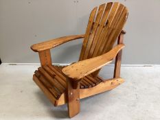 A stained pine Adirondack garden chair, width 78cm, depth 98cm, height 90cm