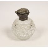 A late Victorian repousse silver mounted cut glass scent bottle, with Reynold's Angels decoration,
