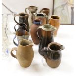 Eleven studio stoneware jugs / pitchers, including Muchelney tallest 26cm