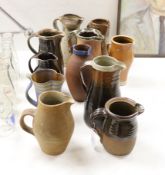 Eleven studio stoneware jugs / pitchers, including Muchelney tallest 26cm