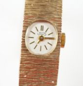 A lady's 1970's 9ct. gold Uno manual wind bracelet wrist watch with a bark textured bracelet,