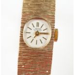 A lady's 1970's 9ct. gold Uno manual wind bracelet wrist watch with a bark textured bracelet,