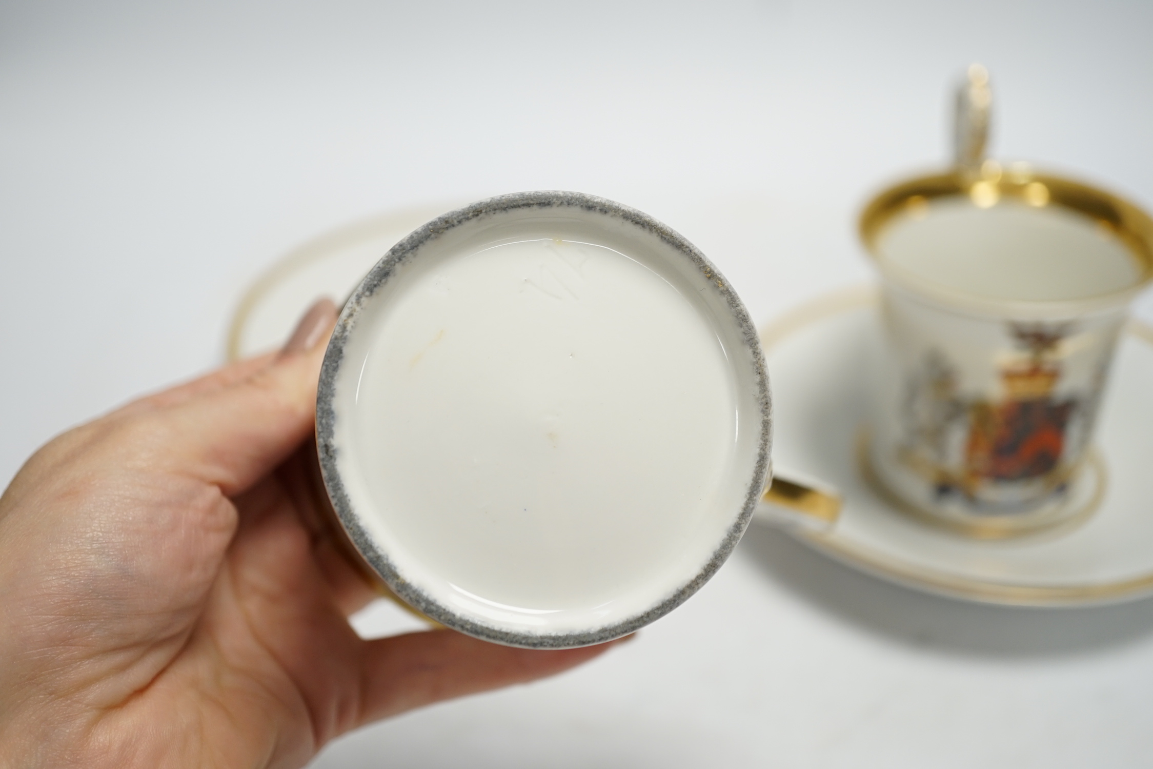 A pair of German porcelain armorial cups and saucers, one saucer reads ‘Lord Bingham s/m Y. - Image 4 of 9