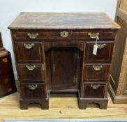An 18th century banded walnut kneehole desk, width 80cm, depth 49cm, height 77cm