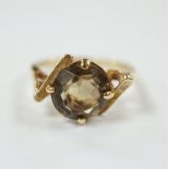 A 14k yellow metal and single stone citrine set dress ring, size N/O, gross weight 3.9 grams.