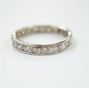 A white metal and diamond set full eternity ring, size U, gross weight 5 grams.
