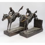 A pair of bronzed resin models of steeplechasers, 31cm