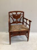 A 19th century Continental fruitwood elbow chair, width 60cm, depth 44cm, height 90cm