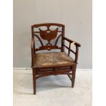 A 19th century Continental fruitwood elbow chair, width 60cm, depth 44cm, height 90cm