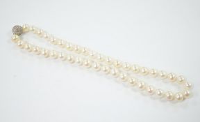 A modern single strand cultured pearl necklace with pave set diamond mounted spherical yellow