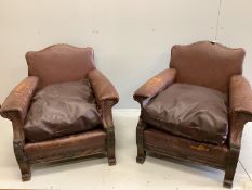 A pair of early 20th century French brown leather studded club chairs, width 84cm, depth 84cm,