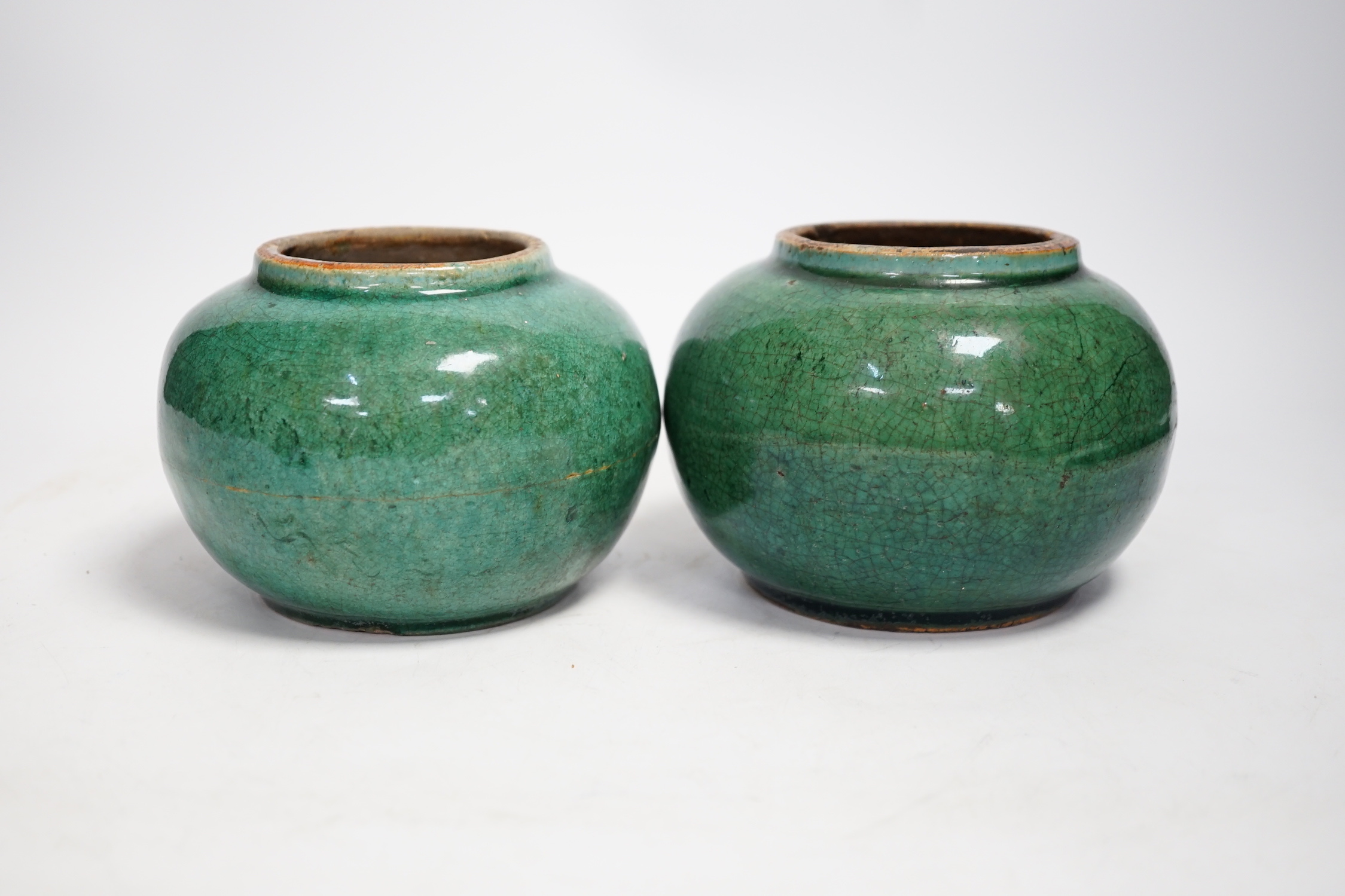 A pair of Chinese pottery monochrome green glazed jars, 10cm high - Image 3 of 4