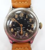 A gentleman's 1940's/1950's stainless steel manual wind wrist watch, with black Arabic dial and