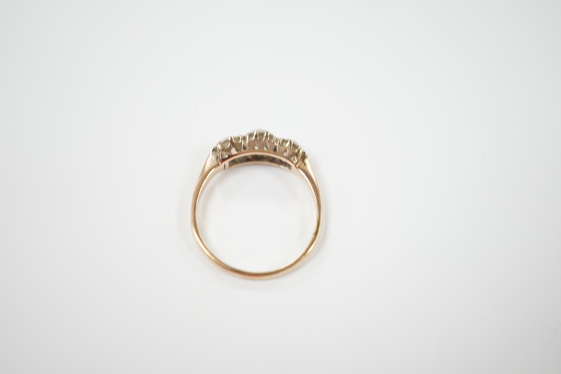 A yellow metal and three stone diamond set ring, size P, gross weight 2.6 grams. - Image 4 of 4