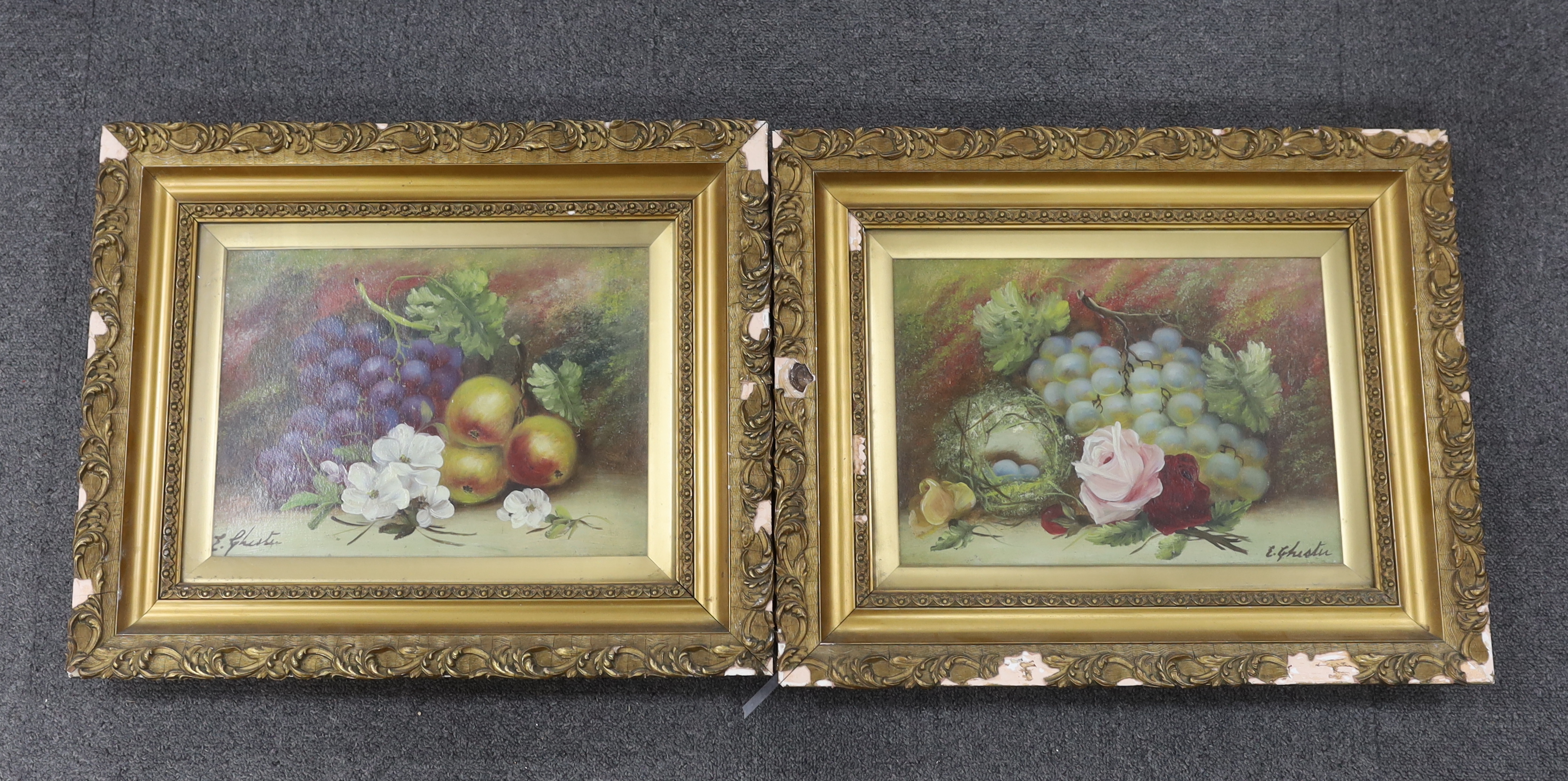 E. Ghist, pair of oils on board, Still lifes of fruit and flowers, each signed, 23 x 32cm