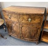 A George IV flame mahogany bowfront press cupboard, width 115cm, depth 61cm, height 108cm