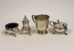 A 1950's silver christening mug, 70mm and a similar silver three piece condiment set.