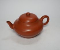 A 19th century Chinese Yixing teapot and cover, possibly for the Thai market, 9cm tall